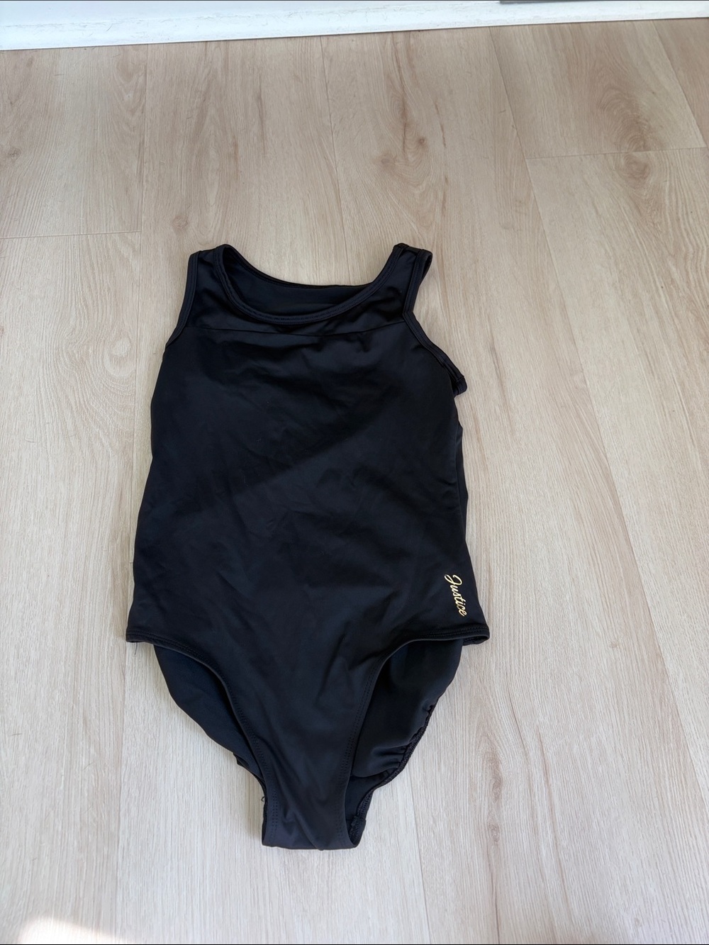 Justice Black One-Piece leotard with Gold Logo